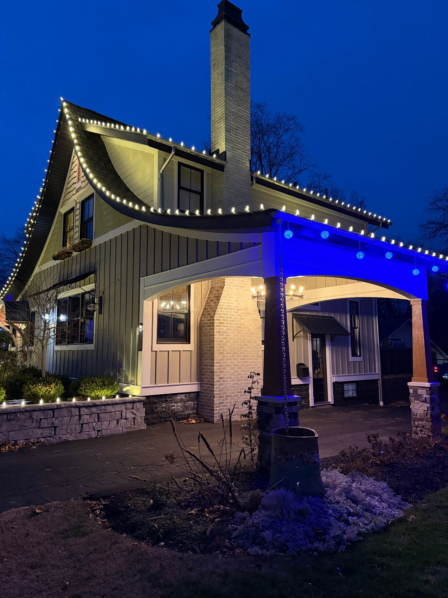 Cottage style home with blue accent lights