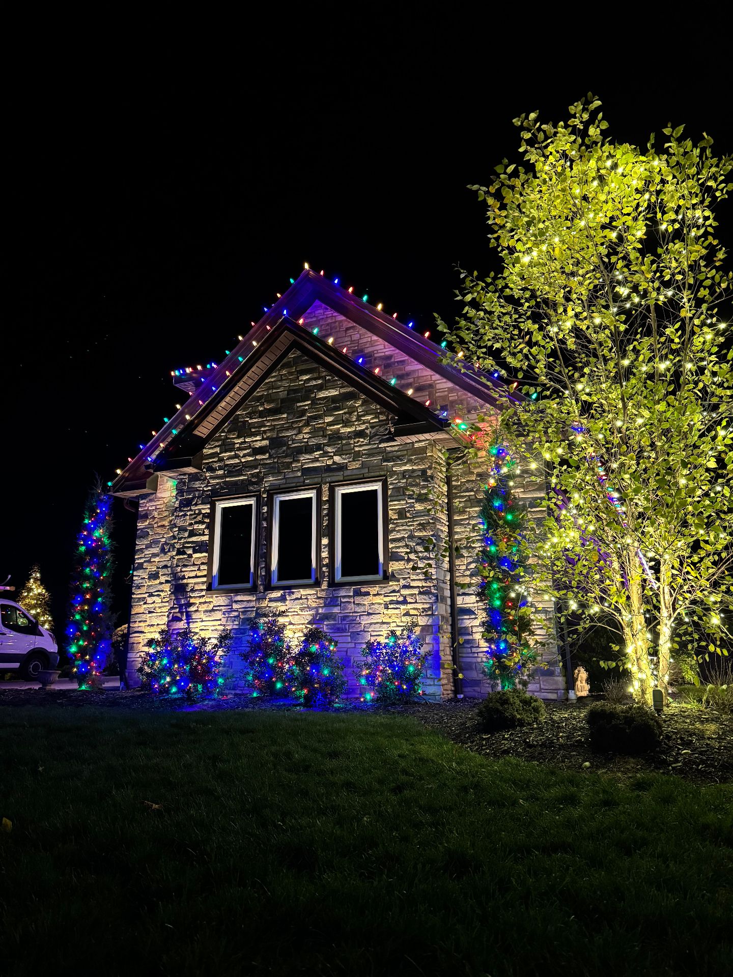 Stone house with multicolor lights