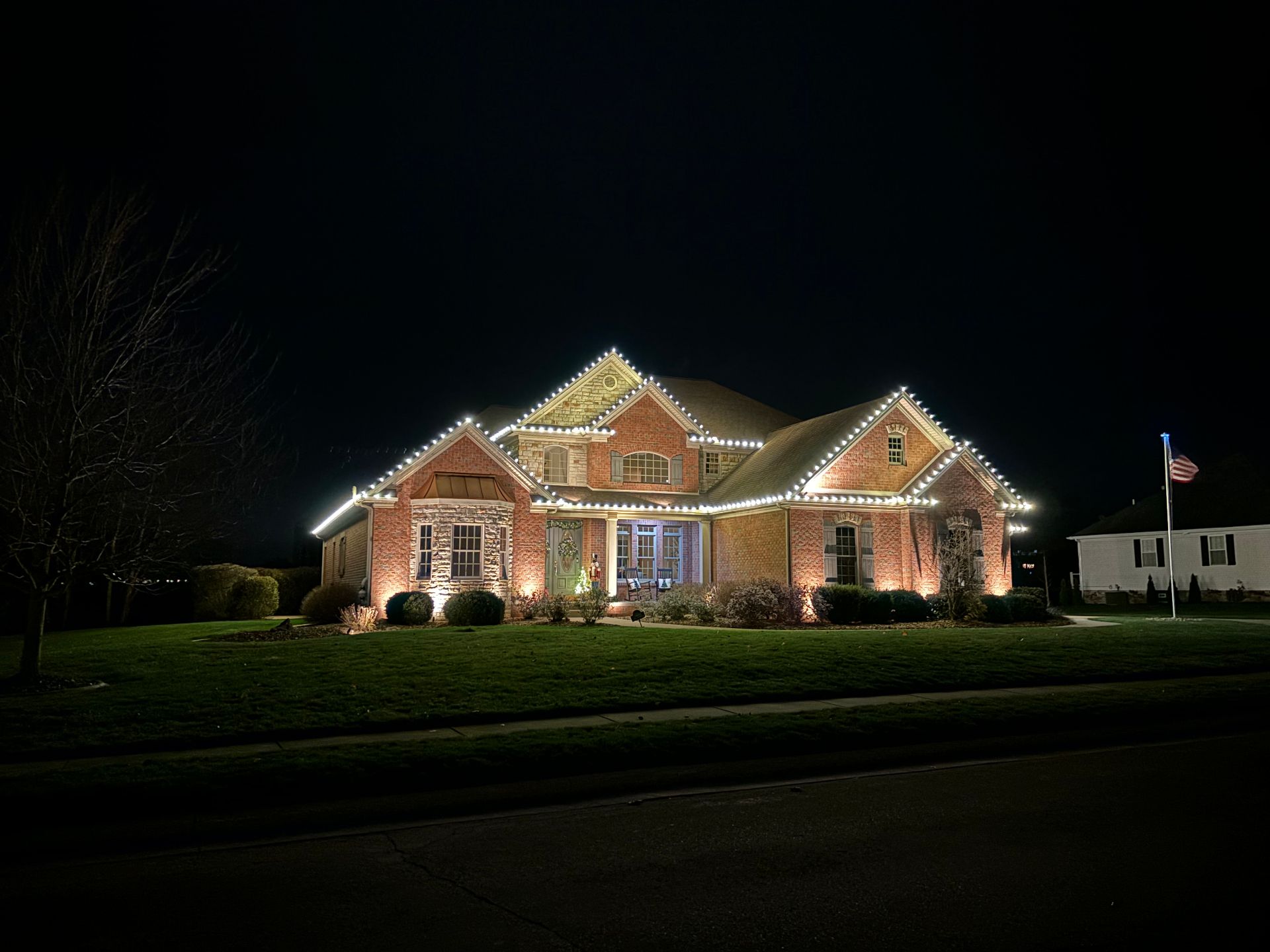 Brick home with warm white roofline
