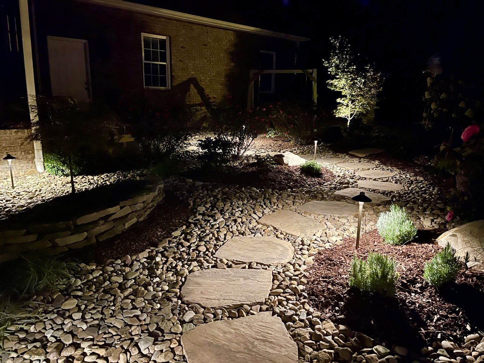 Pathway stepping stones with garden lighting