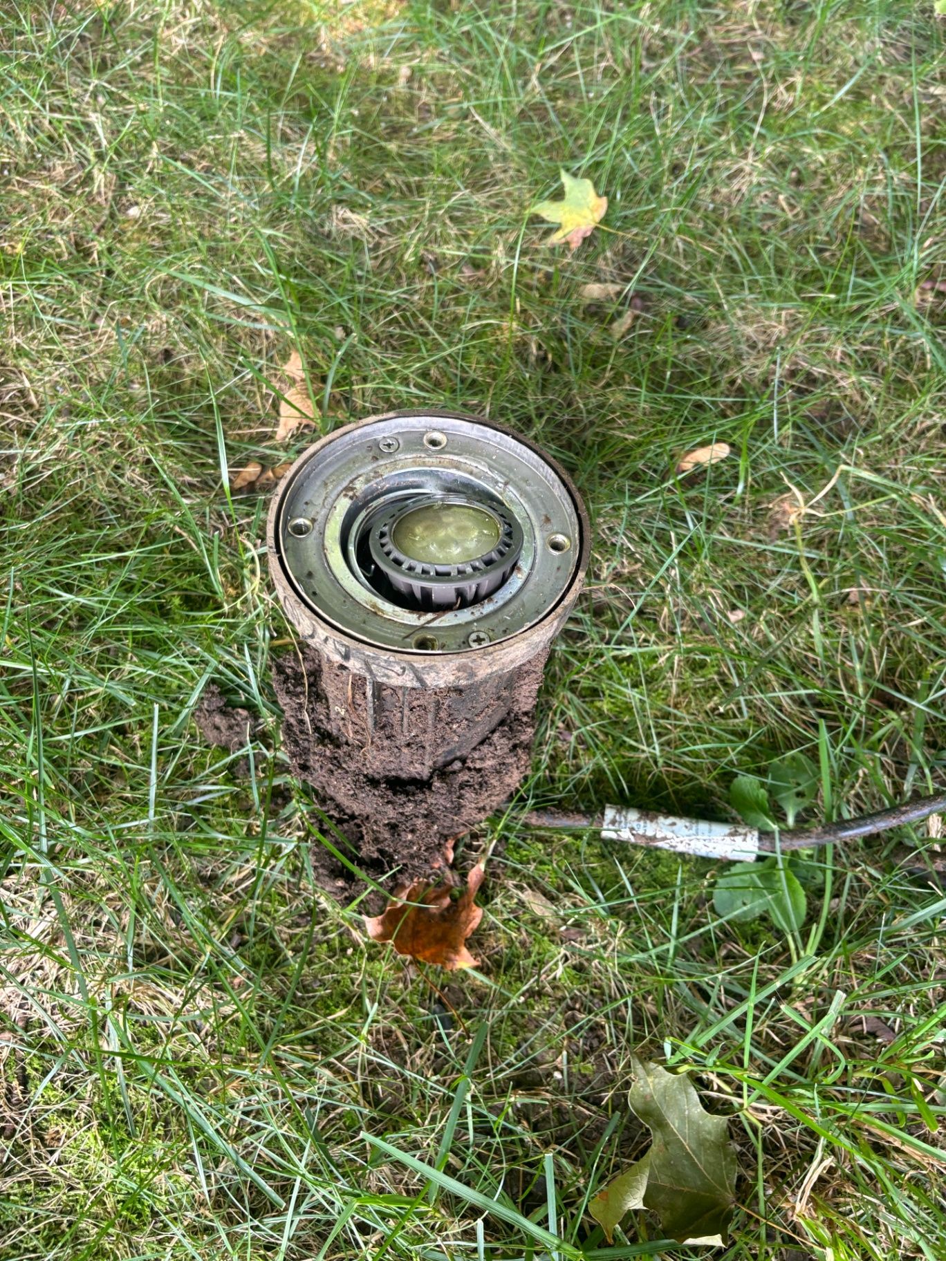 In-ground fixture with dirt buildup