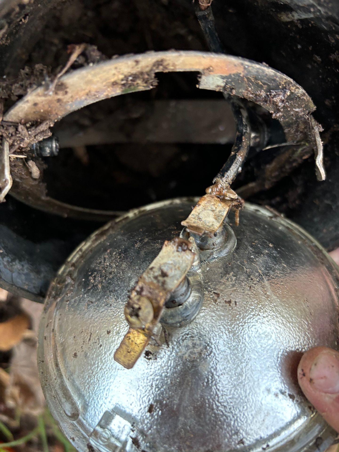 Corroded fixture with damaged wiring
